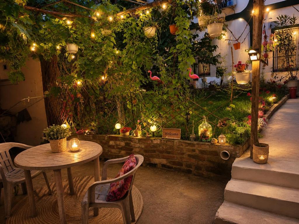a patio with a table and chairs and a garden with lights at Private Guest Room with Garden Access in Skopje