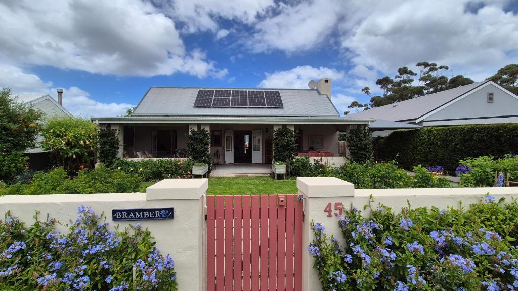 a house with solar panels on the roof at Bramber cottage Stay a while in Stanford