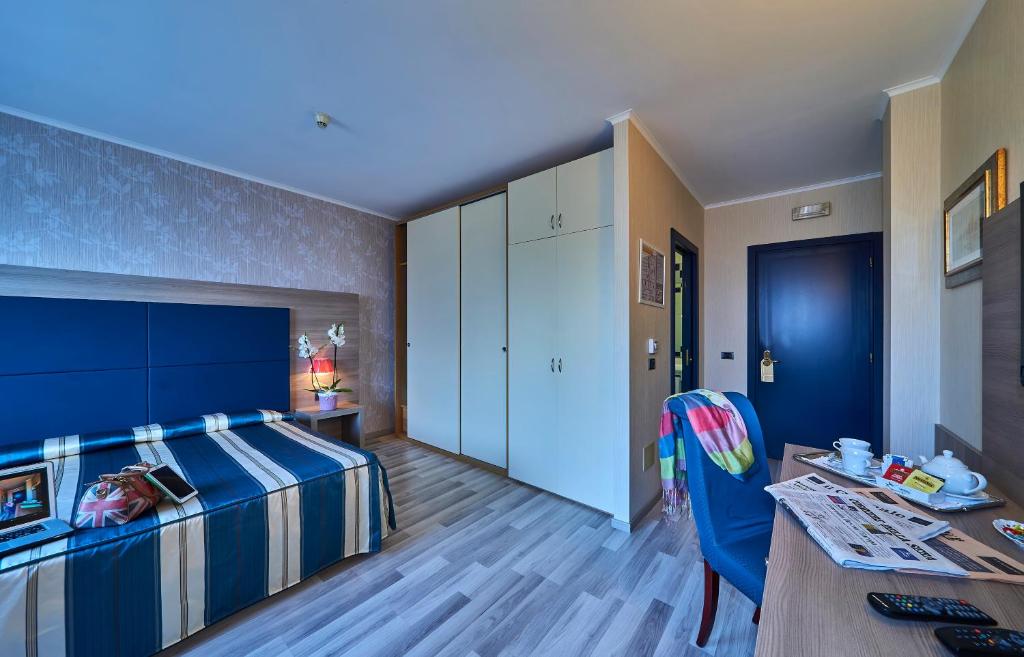 Postel nebo postele na pokoji v ubytování Hotel Alberi