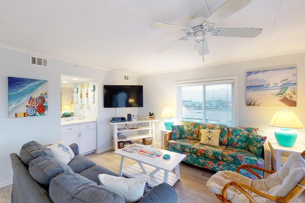 a living room with a couch and a table at Crystal Sands 403 in Ocean City