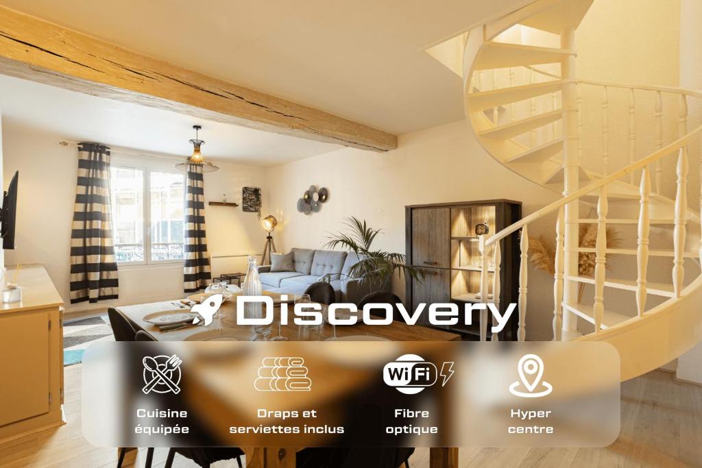 a view of a living room with a spiral staircase at Duplex hyper centre tout équipé - Arrivée autonome in Troyes