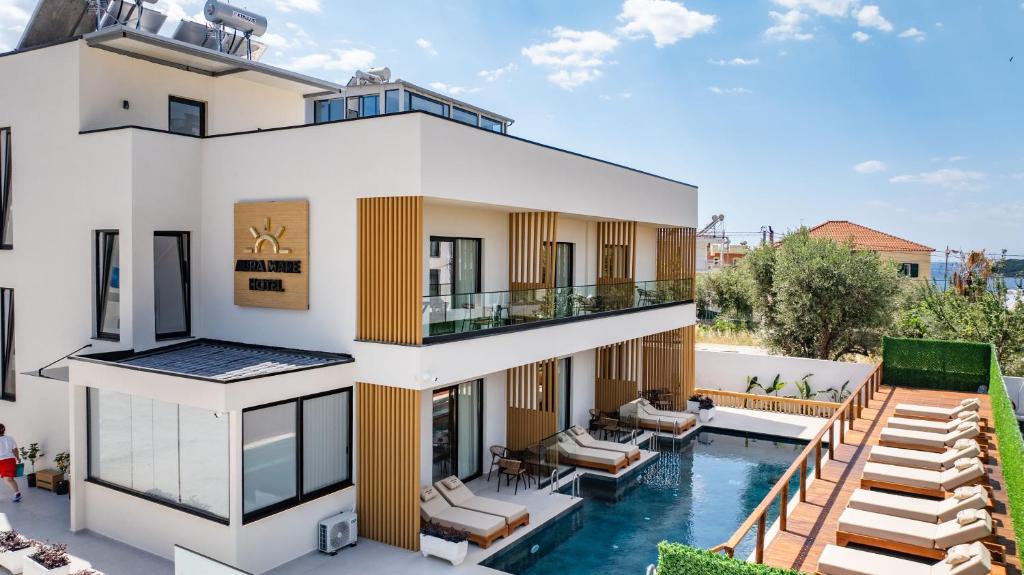 an aerial view of a house with a swimming pool at Aura Mare Hotel in Ksamil