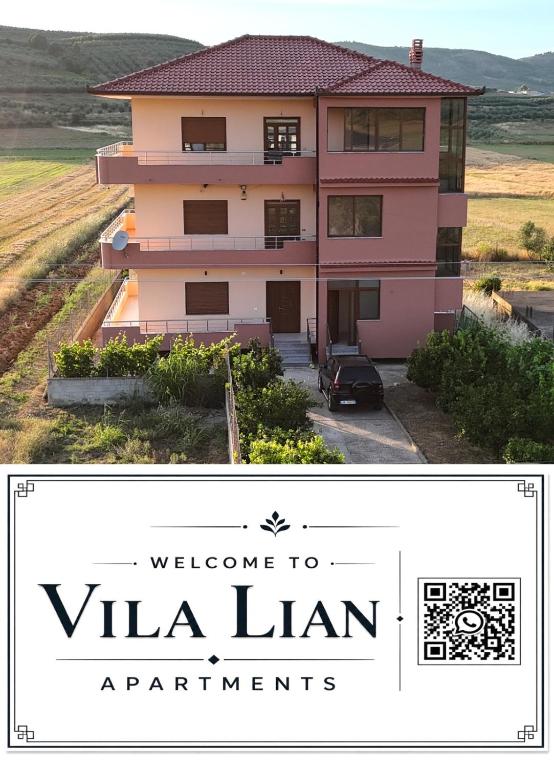 a pink house with the words welcome to vla lin apartments at Vila Lian Apartaments in Belsh