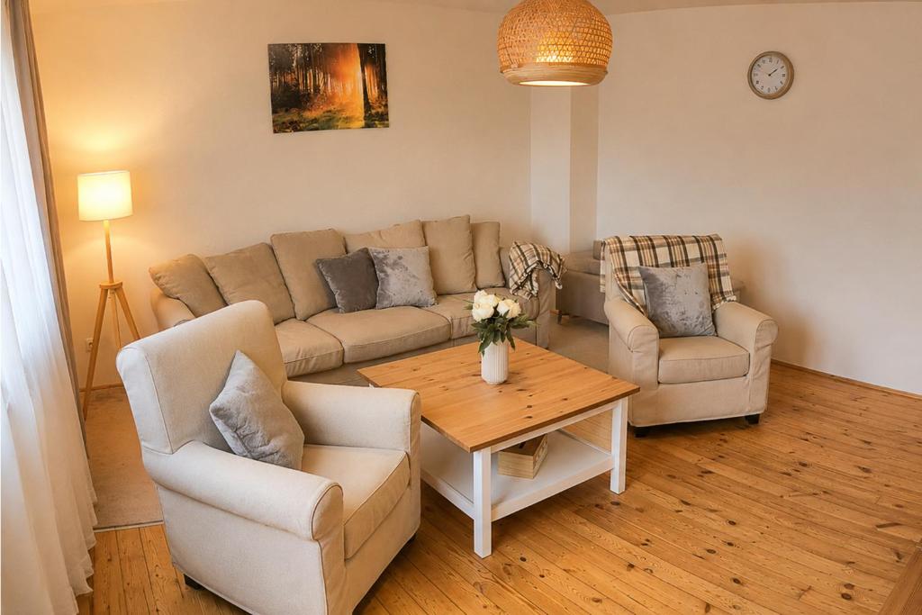 a living room with a couch and two chairs and a table at Apartmány Lipno 46 in Lipno nad Vltavou