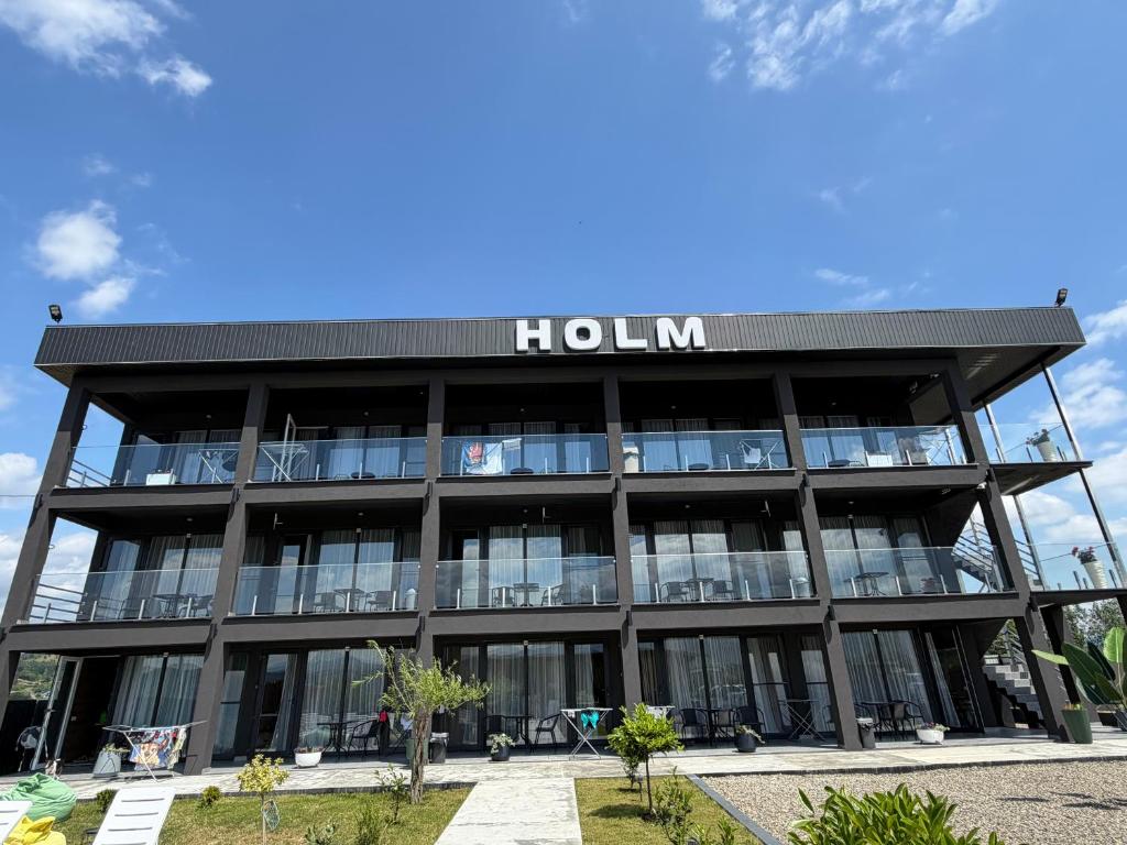 a building with a hilton sign on it at Villa HOLM in Solotvyno