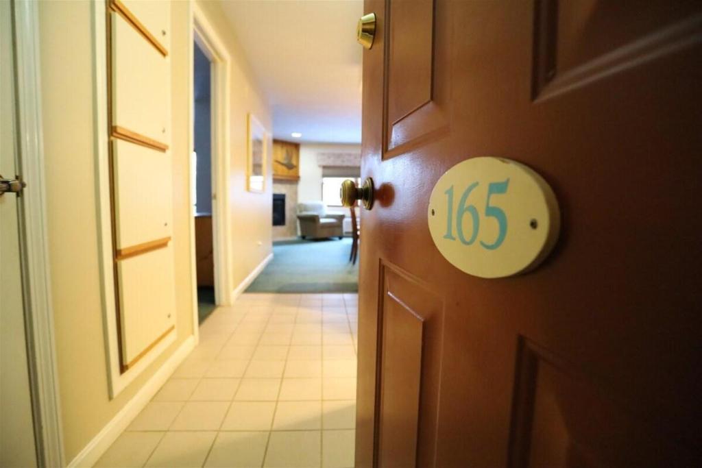 an open door with the number on it at Deer Park Condo 165D Vacation Rental near Loon Mountain in Woodstock