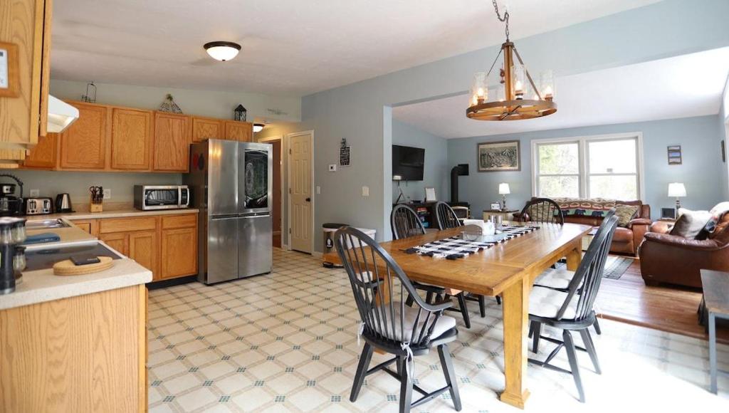 a kitchen and living room with a table and chairs at Bog Road 76 Campton Cozy Private Single Family Home in Campton in Campton