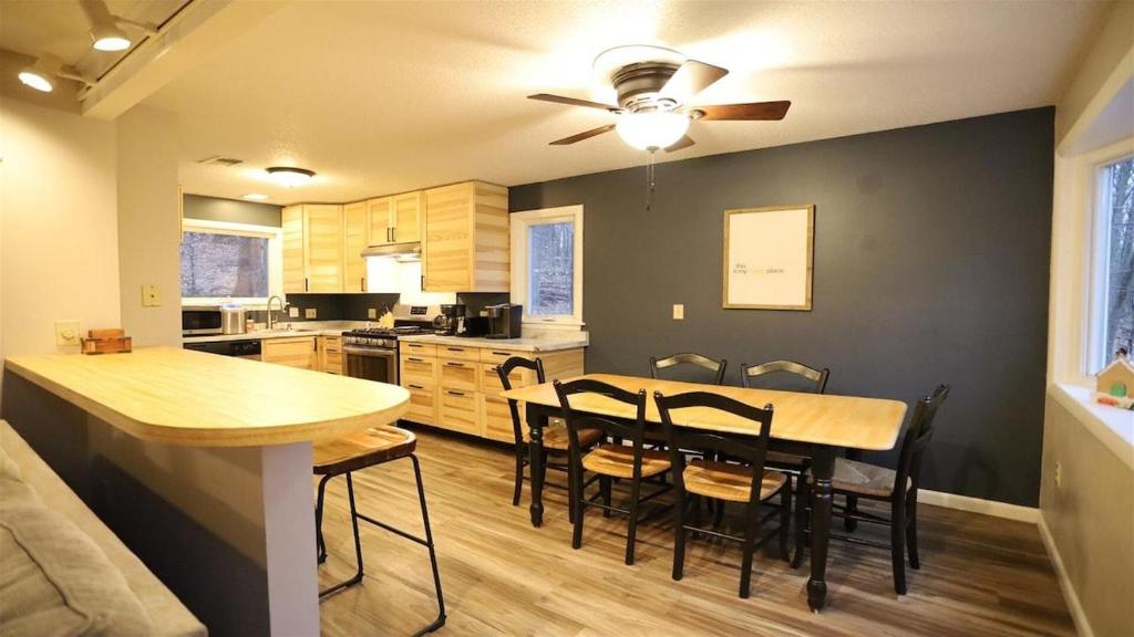a kitchen and dining room with a table and chairs at Green Circle 29 Estates Pet Friendly Private Home in Waterville Estates in Campton
