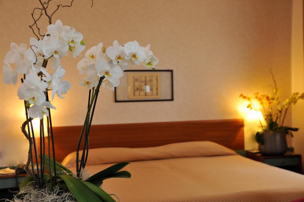 Postel nebo postele na pokoji v ubytování Hotel Filanda