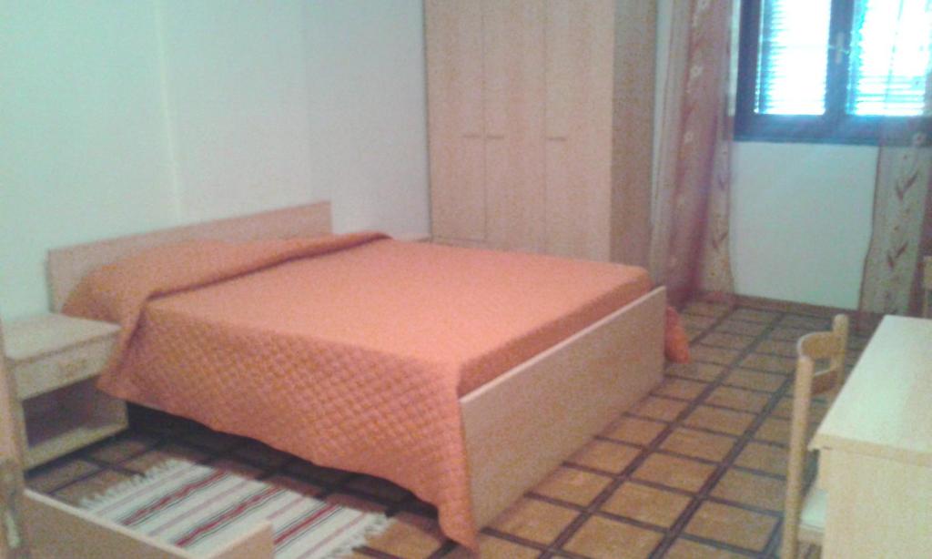 Postel nebo postele na pokoji v ubytování B&B Tufaro Alberico