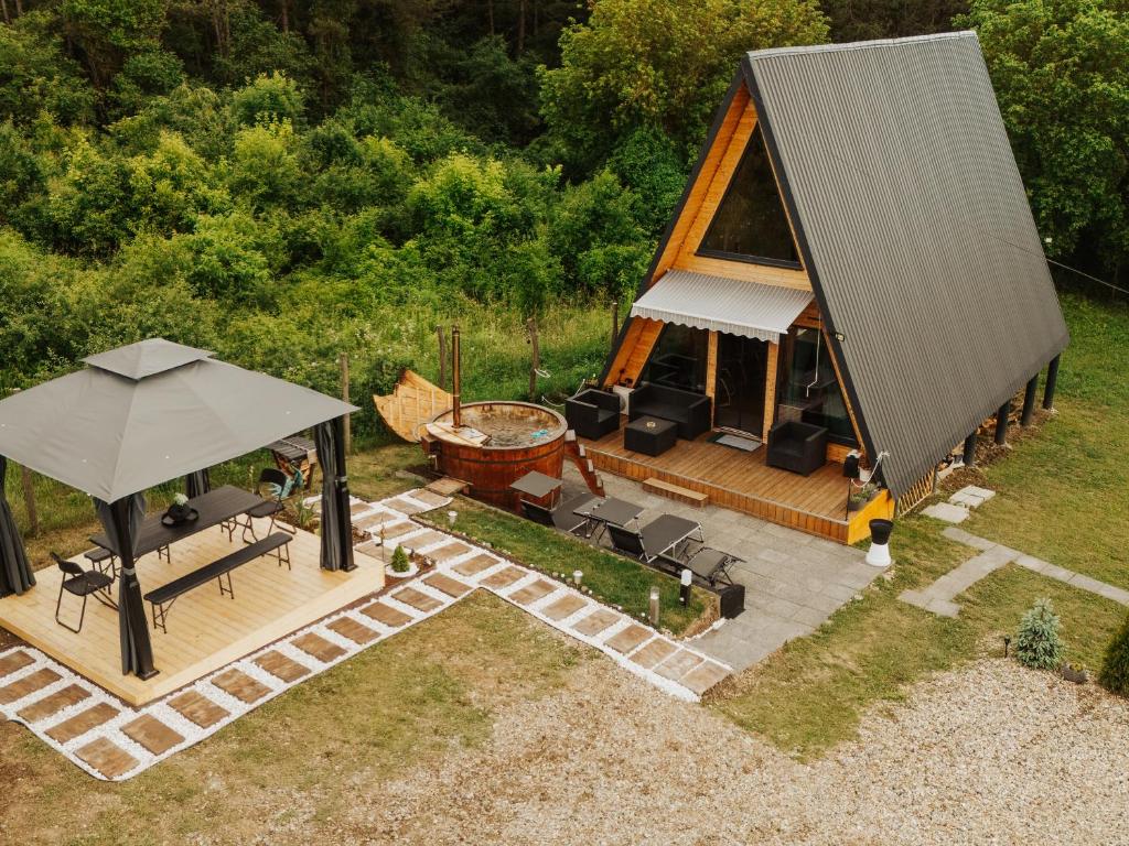 an overhead view of a gazebo with a grill at A-Forest Retreat - David's A-frame in Ocna-Mureşului