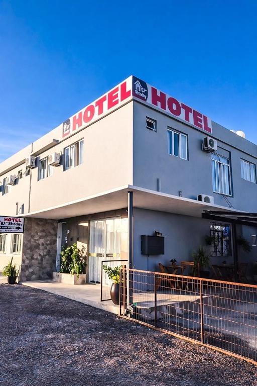 a hotel with a sign on the side of it at Hotel El-Shaday in Vila Nova do Sul