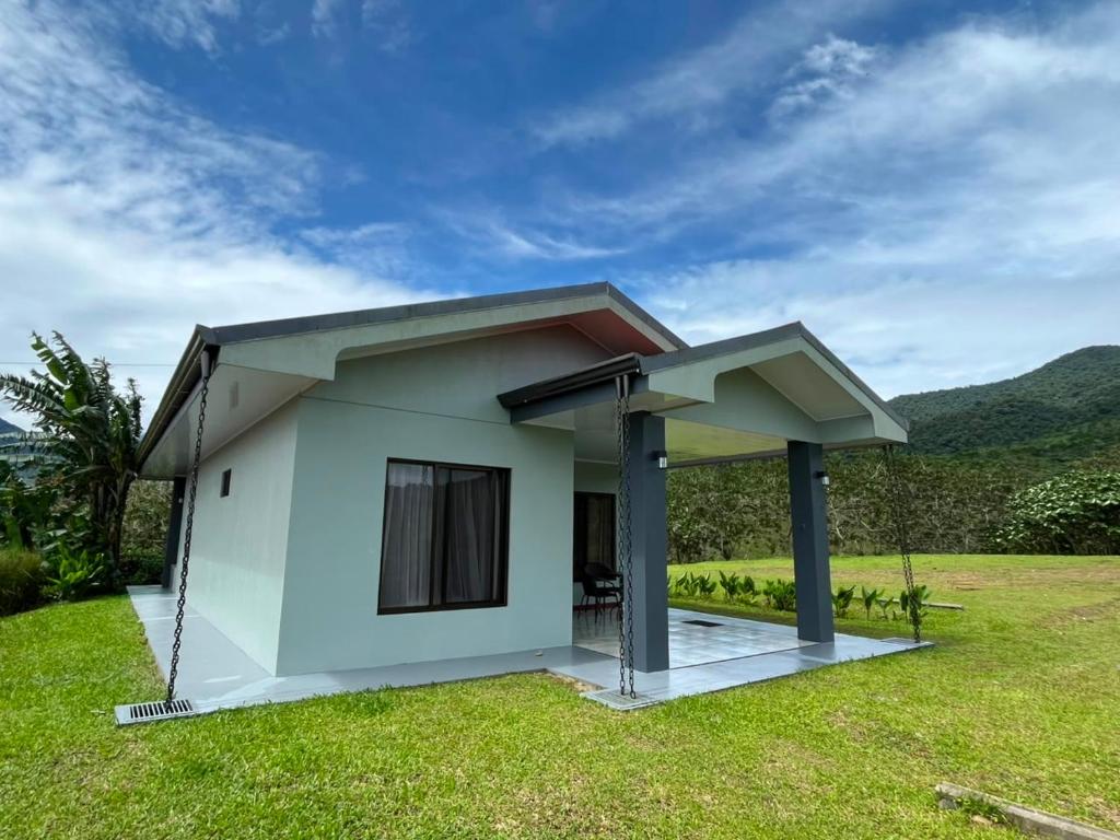 a small house with a roof at Paradise Experience Costa Rica in Pueblo Nuevo