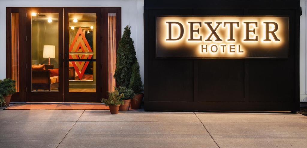 a hotel sign on the front of a building at Dexter Hotel in Elk Rapids