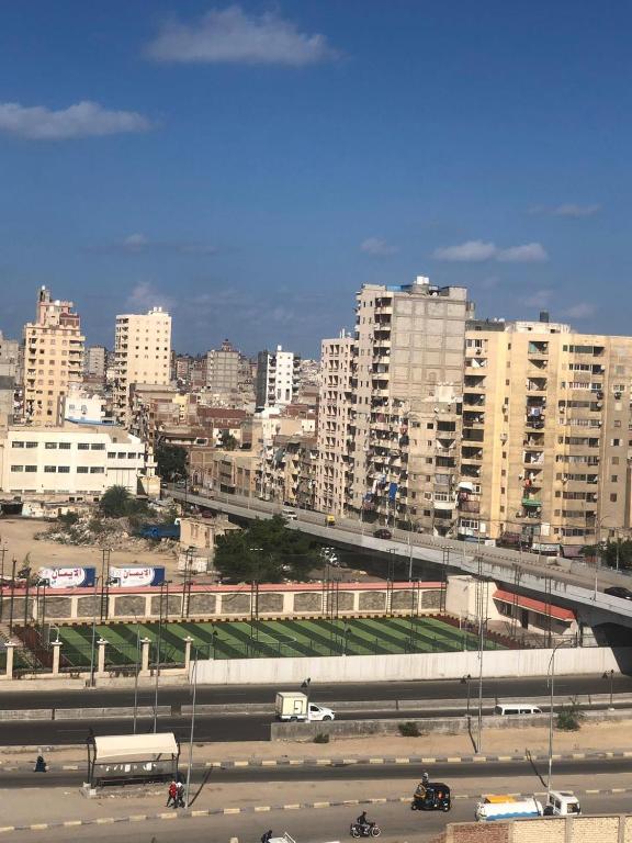 a view of a city with a highway and buildings at Maria Apartment in Alexandria