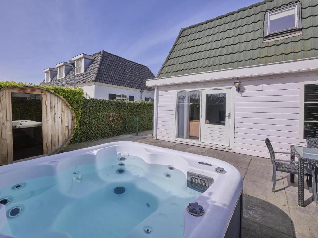 a hot tub in the backyard of a house at t Kaatsheuveltje 1 in Kaatsheuvel