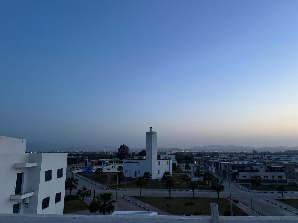 a view of a city from a building at Alhoceima - vue sur la mer- Green village2 in Al Hoceïma