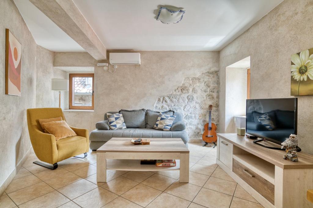 a living room with a couch and a table at Historic Old Town Kotor in Kotor