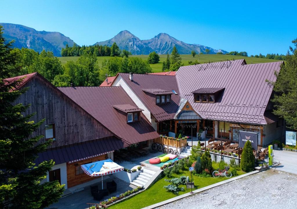 an aerial view of a house with mountains in the background at SOVA Hotel&Restaurant in Ždiar