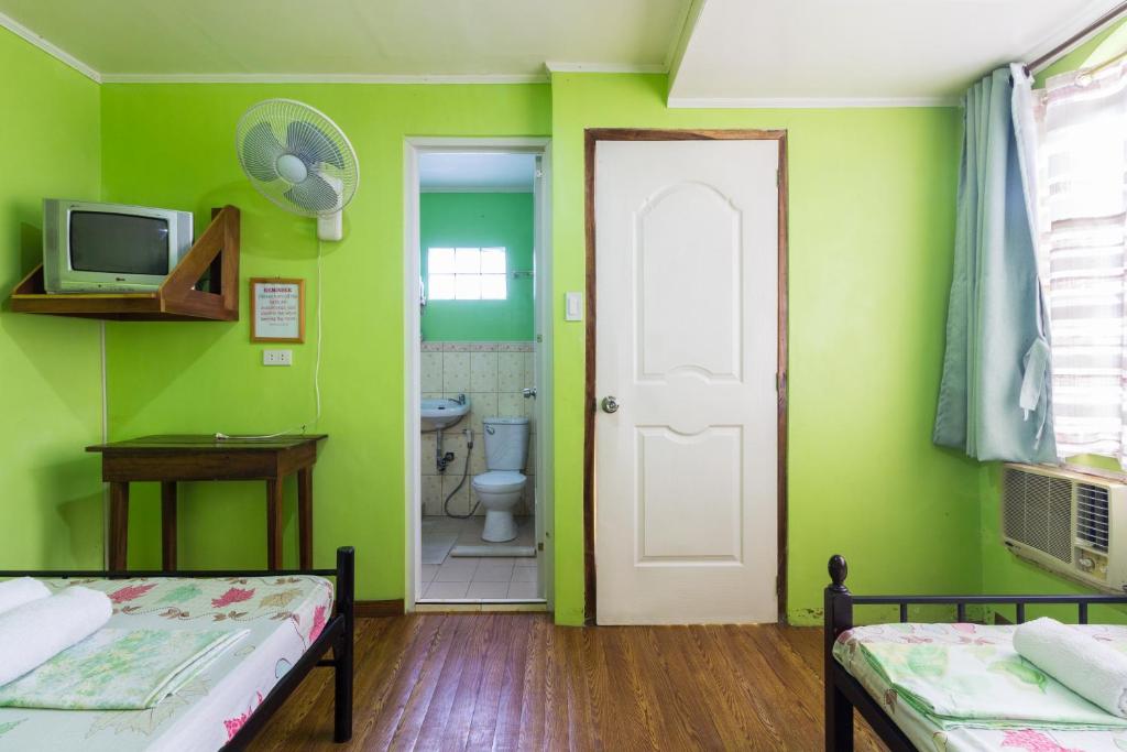 Postel nebo postele na pokoji v ubytování Donsol Aguluz Homestay