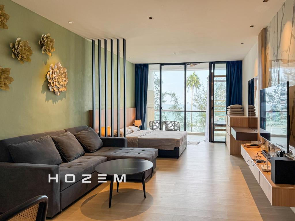 a living room with a couch and a bed at SB1B4P Hozem SA B46 Roxy Sematan in Sematan