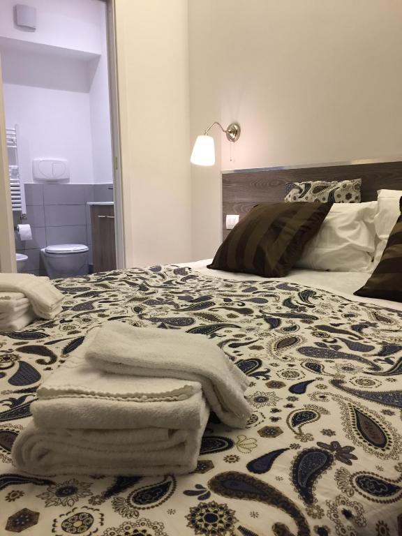 A bed or beds in a room at De Guestibus