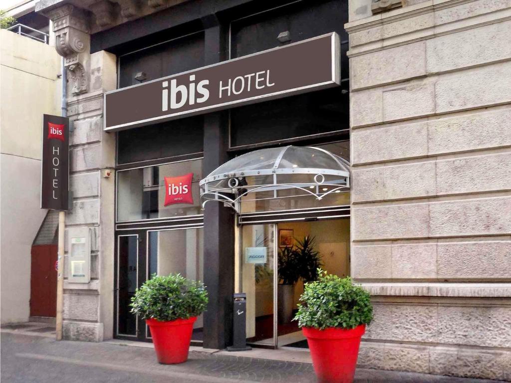 two potted plants in front of a hotel at ibis Grenoble Centre Bastille in Grenoble