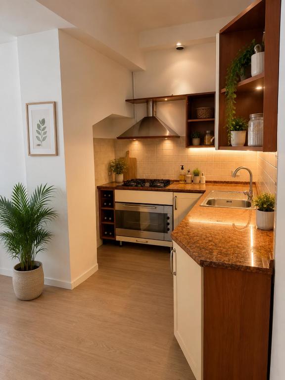 a kitchen with a sink and a stove at BluTerra home in Porto San Giorgio