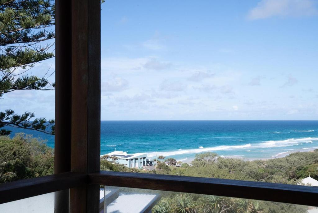 a view of the ocean from a window at Quampi House with Best Ocean View in Point Lookout