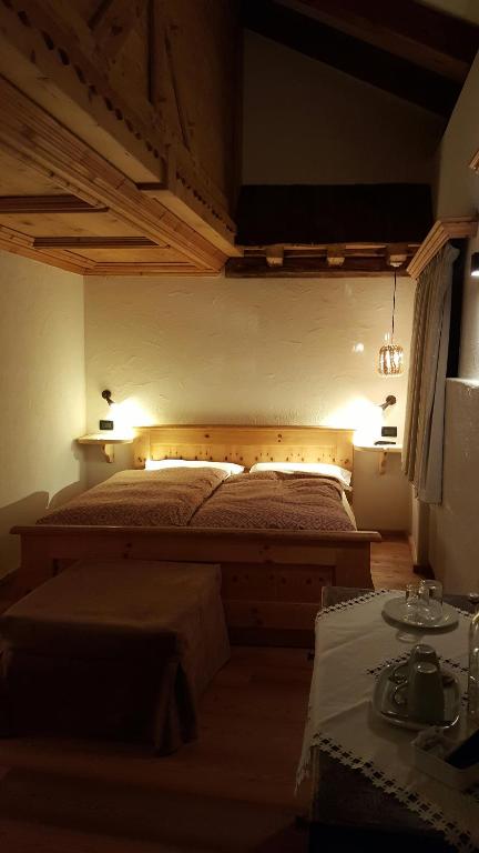 Postel nebo postele na pokoji v ubytování Historic Hotel Ristorante La Stua