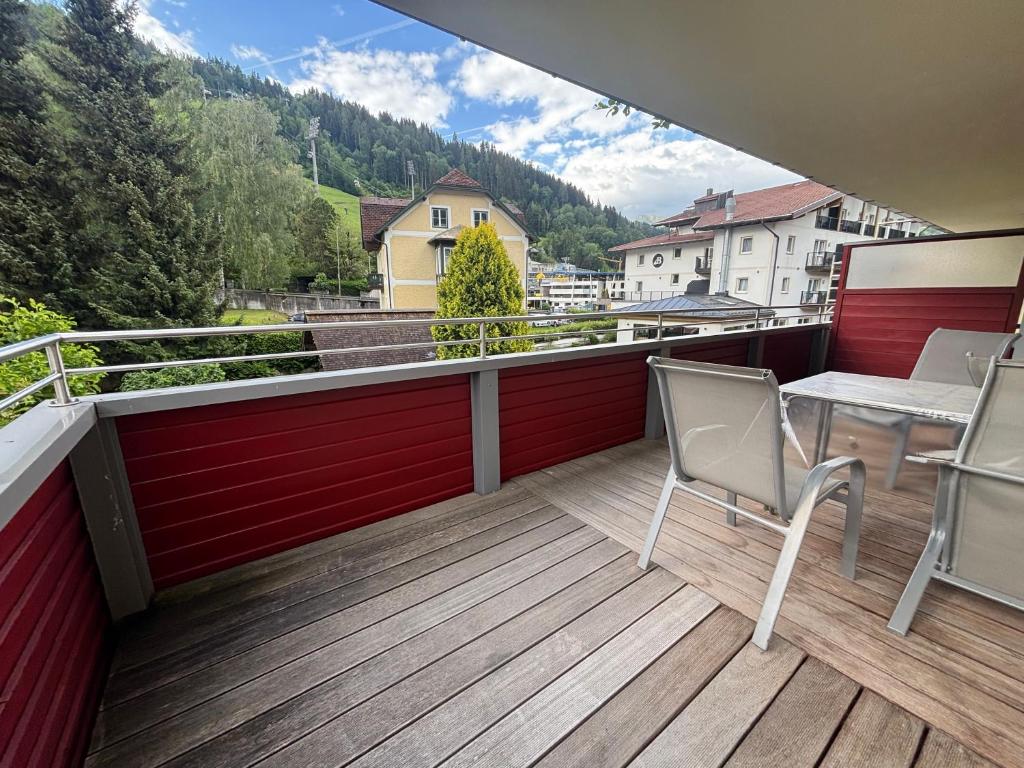 a balcony with a table and chairs and a view at My Adventure Appartements by Schladmingurlaub - 150 Meter zur Gondel in Schladming