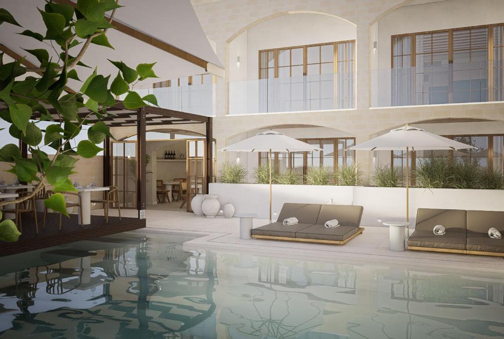 a villa with a swimming pool and a patio at Casa Azure Meliá Collection in San Lawrenz