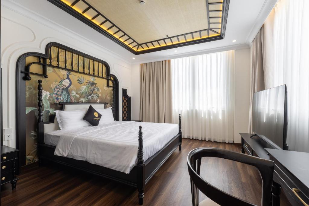 a bedroom with a large bed with a large headboard at Can Gio Park Hotel in Cần Giờ