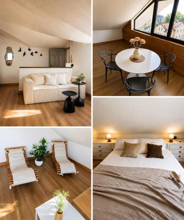 a bedroom and a living room with a bed and a table at mansarda roulette in Saint Vincent