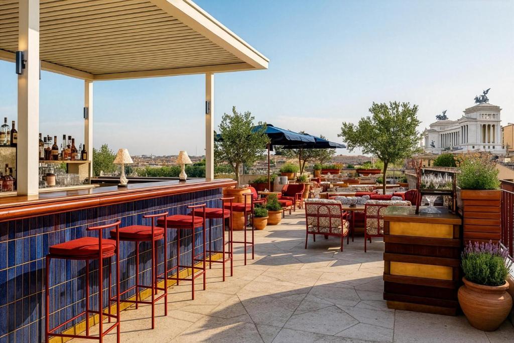 a bar with red chairs and tables on a patio at Thompson Rome, By Hyatt in Rome