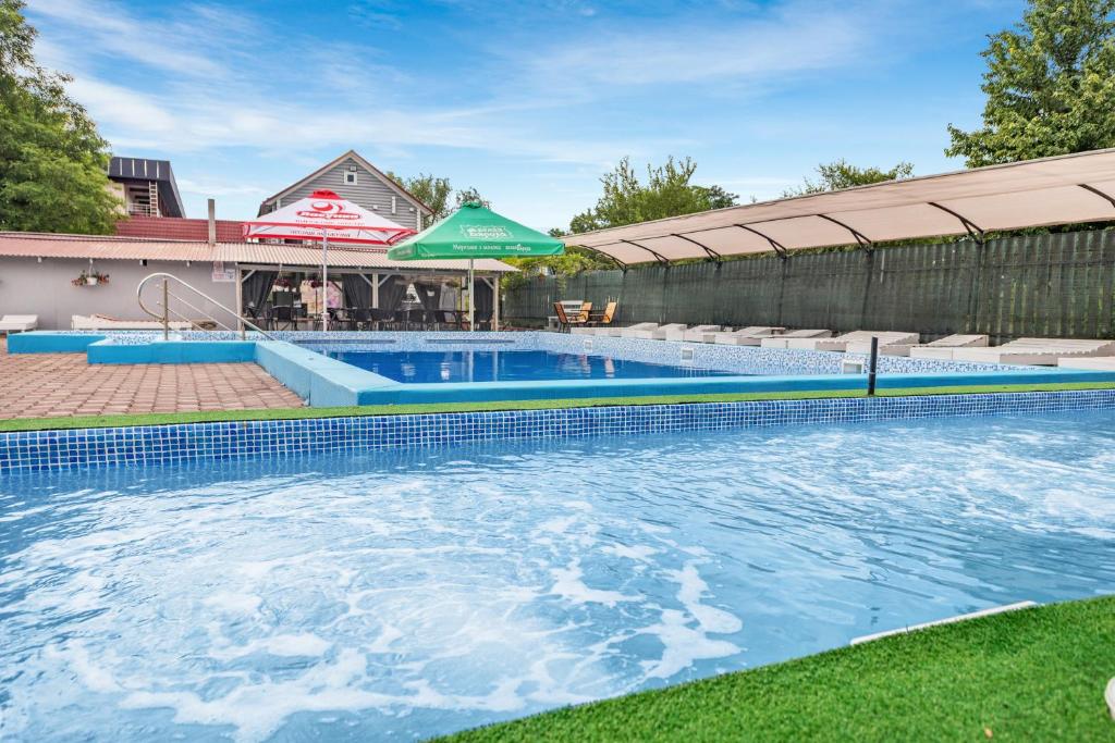 a large swimming pool in a yard at Fiesta in Solotvyno