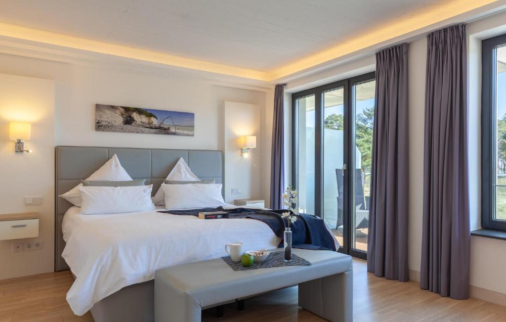 a hotel room with a bed and a table at Skipper in Binz