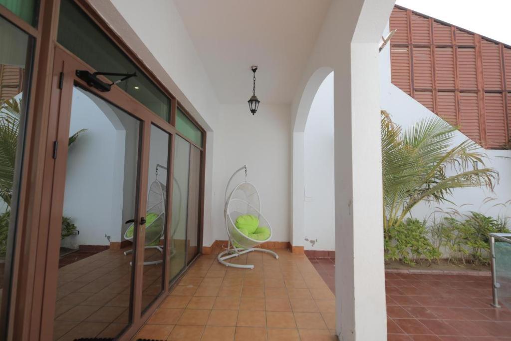 a room with two chairs in the middle of a building at Rose Beach 4 Durrat Alarous in Durat Alarous