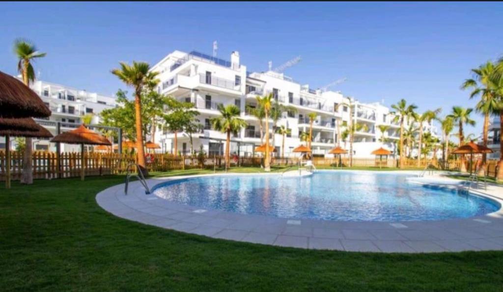 a large apartment building with a large swimming pool at LM APARTAMENTOS Aguacate 5 in El Varadero