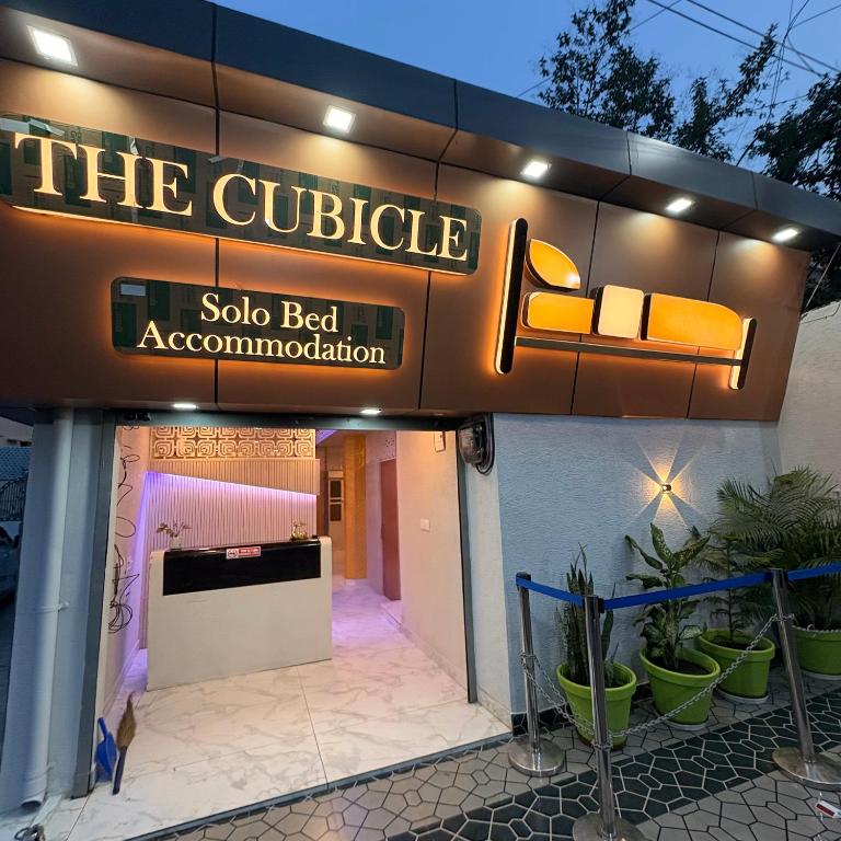 a sign for a club called the cubicle sidx bed accommodation at The Cubicle in Haldwāni