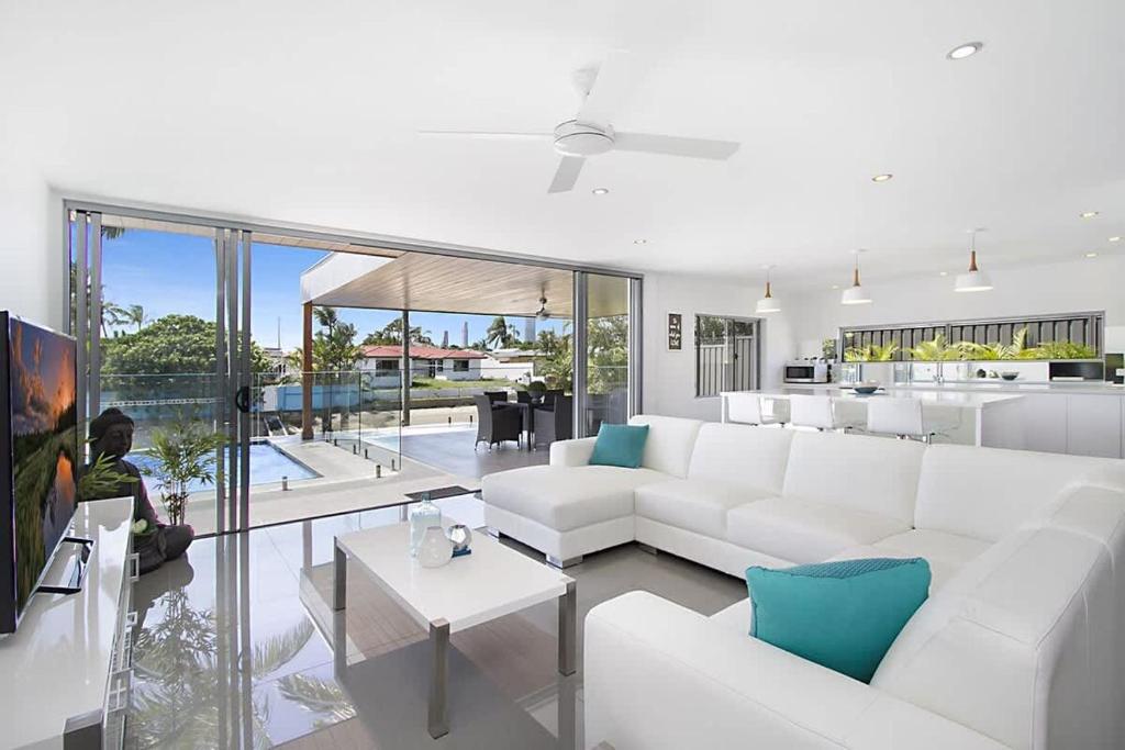 a living room with a white couch and a table at Buena Vista in Gold Coast