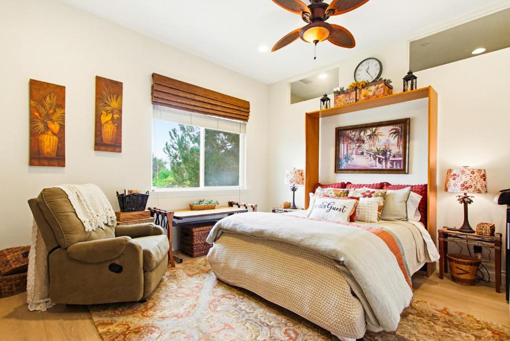 a bedroom with a bed and a chair at Morning Glory Retreat-Private Lux 1-Bedroom Suite in a Tropical Resort Setting in Vista