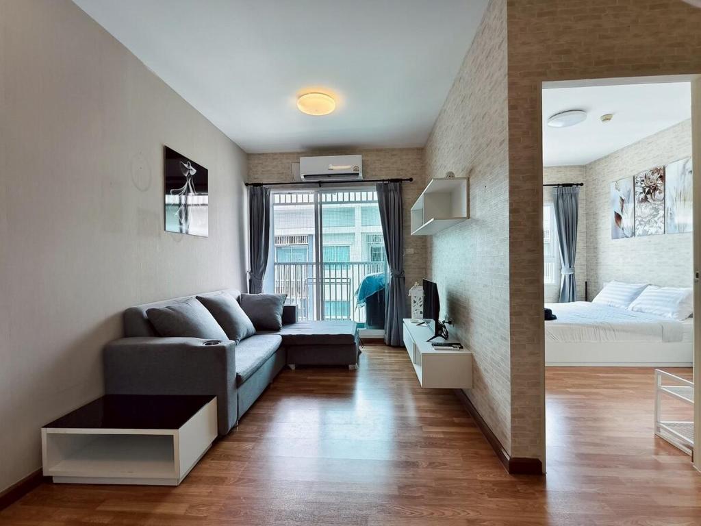 a living room with a couch and a bed at Condo in Hua Hin in Hua Hin