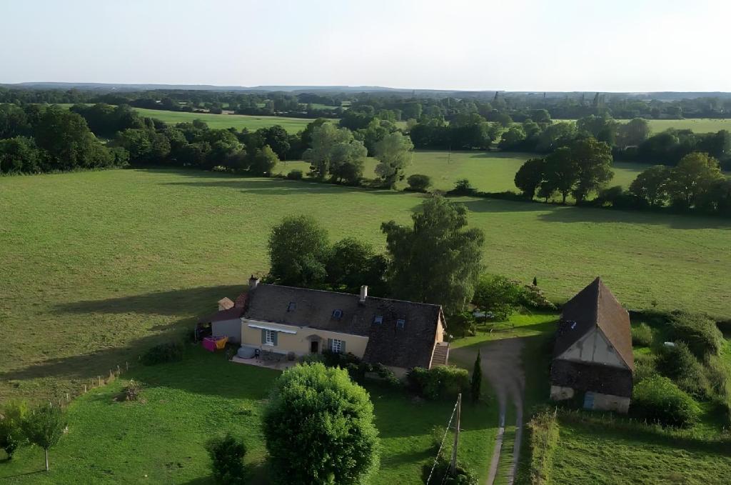 an aerial view of a house in a field at La Rivetière in Courcemont