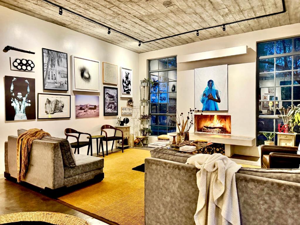a living room with two couches and a fireplace at Afrika House in Nairobi