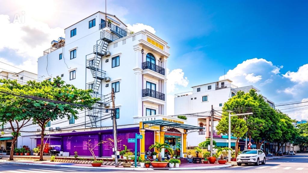 a white building on the side of a street at New Conson Hotel in Con Dao