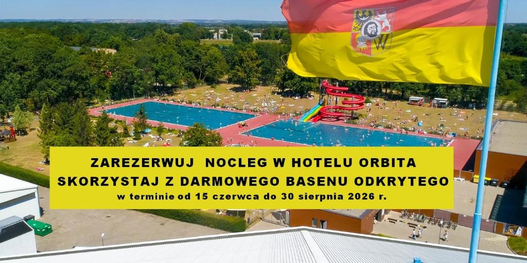 an overhead view of a water park with a flag at Hotel Orbita in Wrocław