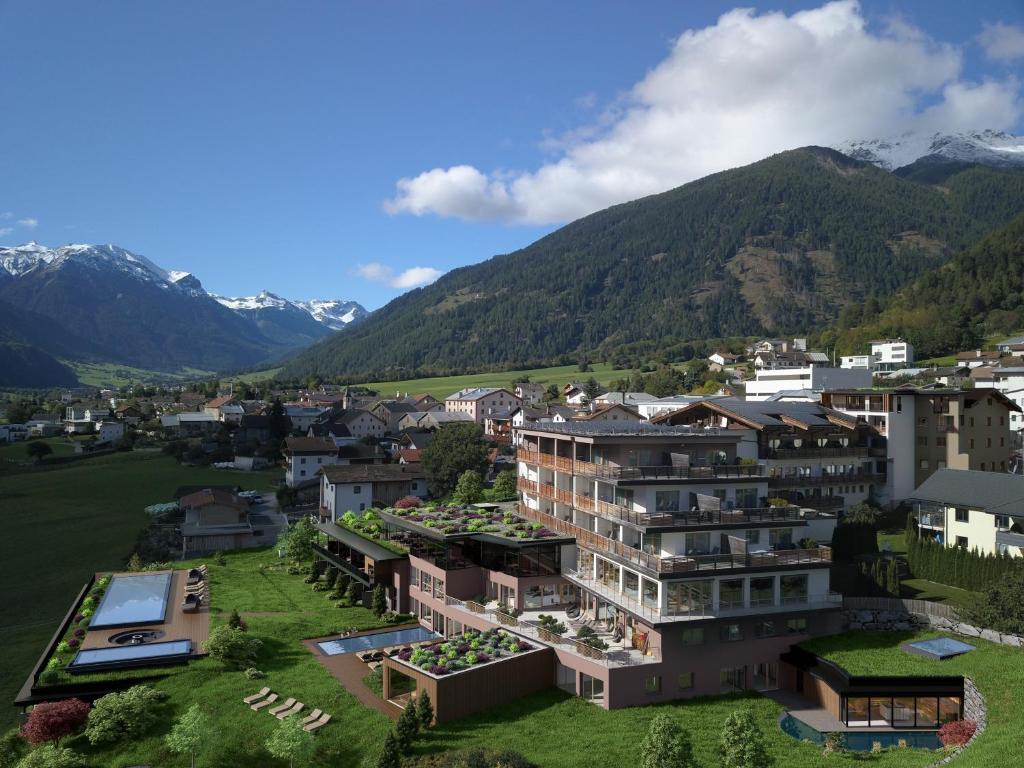 an aerial view of a town with mountains in the background at Tuberis Life Balance & Nature Farm in Tubre