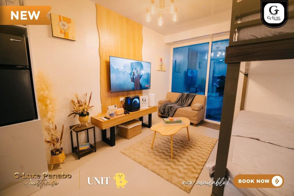 a small living room with a bed and a couch at G-Luxe Panabo Guesthouse - Unit B in Panabo