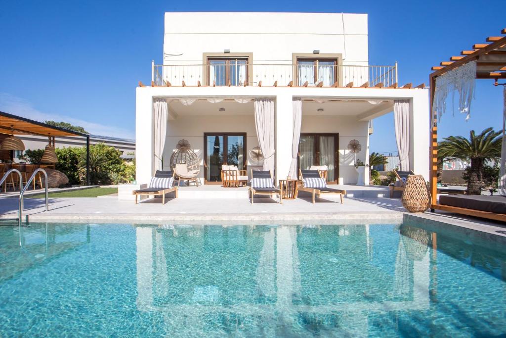 a villa with a swimming pool and a house at Kallisti Luxury Villa in Kallithea Rhodes